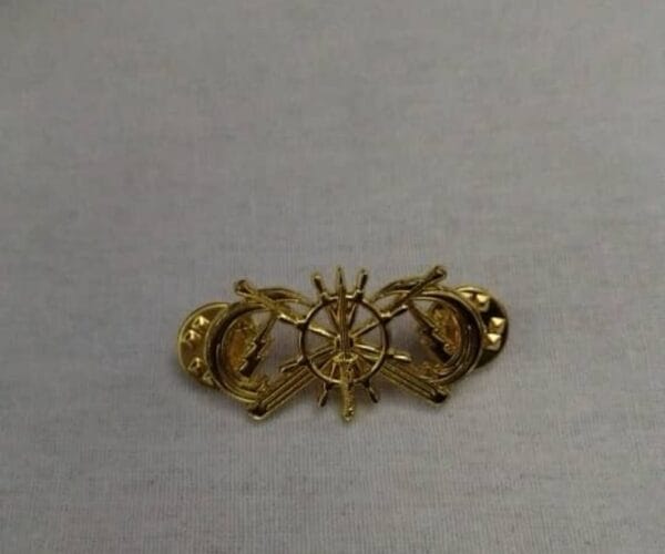 METAL BADGE